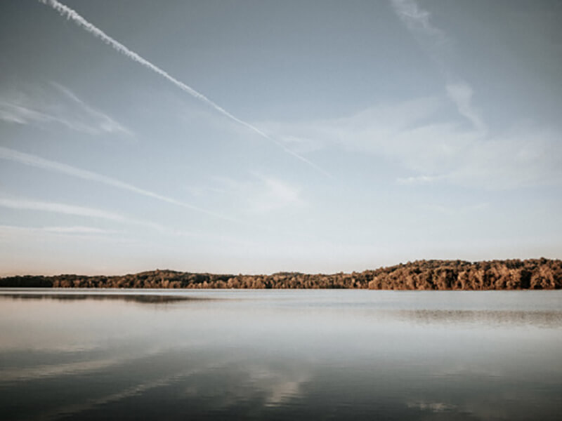 A vast lake with land on the horizon